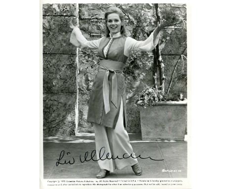 ULLMANN LIV: (1938- ) Norwegian actress. Signed 8 x 10 photograph of Ullmann standing outdoors in a happy full-length pose, t