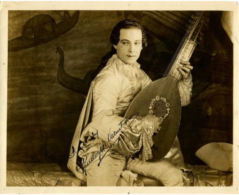VALENTINO RUDOLPH: (1895-1926) Italian actor, a sex symbol of the 1920s. A good vintage signed sepia 10 x 8 photograph of Val