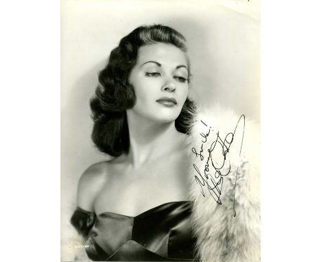 DE CARLO YVONNE: (1922-2007) Canadian-born American actress. Vintage signed 7.5 x 9.5 photograph of the glamourous actress in