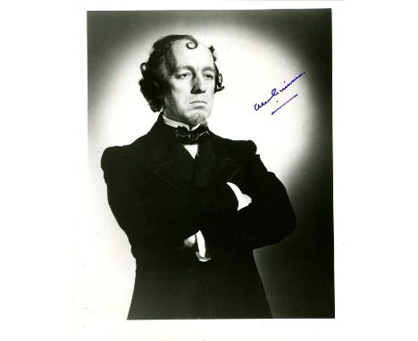 GUINNESS ALEC: (1914-2000) English actor, Academy Award winner. Signed 8 x 10 photograph of Guinness standing in a three-quar