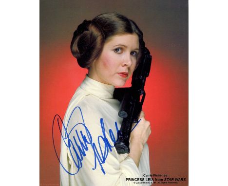 FISHER CARRIE: (1956-2016) American actress. Signed colour 8 x 10 light cardstock image of Fisher in a head and shoulders pos
