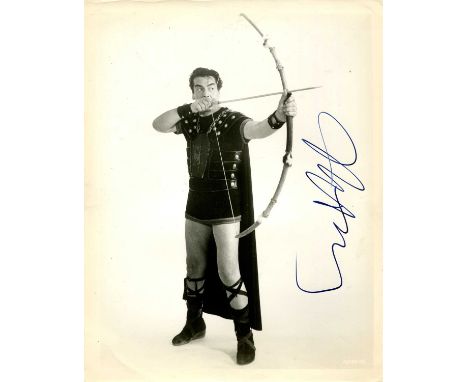 MATURE VICTOR: (1913-1999) American actor. Signed 8 x 10 photograph of Mature standing in a full-length pose in costume as th