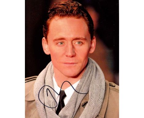 HIDDLESTON TOM: (1981- ) English actor. Signed colour 8 x 10 photograph of Hiddleston in a head and shoulders pose on the occ