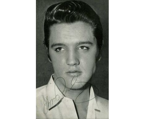 PRESLEY ELVIS: (1935-1977) American rock 'n' roll singer. Vintage signed postcard photograph of the handsome singer in a clos