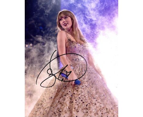 SWIFT TAYLOR: (1989- ) American singer and songwriter. Signed colour 8 x 10 photograph of Swift standing in a full-length pos