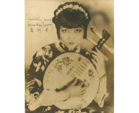 WONG ANNA MAY: (1905-1961) Chinese-American actress. A good vintage signed and inscribed sepia 7 x 9.5 photograph of Wong sea