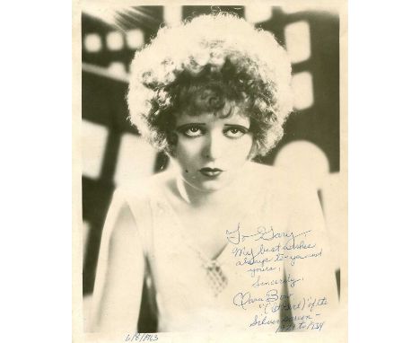 BOW CLARA: (1905-1965) American actress. Vintage signed and inscribed 8 x 10 photograph of the young actress in a head and sh