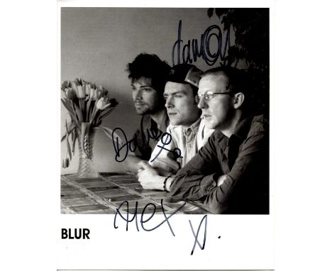 BLUR: Signed 8 x 10 photograph by all three members of the English rock band Blur comprising Damon Albarn, Dave Rowntree and 