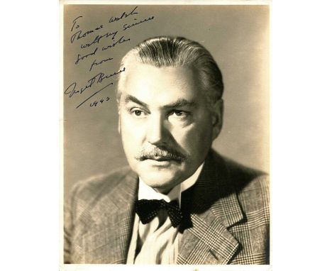 BRUCE NIGEL: (1895-1953) British character actor, remembered for his portrayal of Dr. Watson opposite Basil Rathbone in a ser