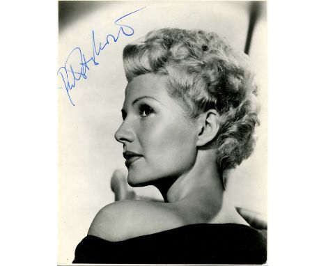 HAYWORTH RITA: (1918-1987) American actress. A good vintage signed 7.5 x 9.5 photograph of Hayworth, the original Columbia Pi