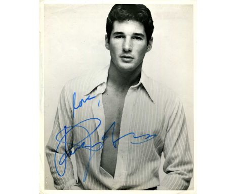 GERE RICHARD: (1949- ) American Actor. Signed 8 x 10 photograph by Gere, the image depicting him standing in a half-length po