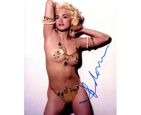 MADONNA: (1958- ) American singer and actress. Signed colour 8 x 10 photograph of Madonna standing in a sexy three-quarter le