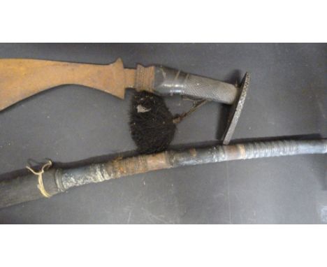 An African Bow Saw with Sheath, together with another similar with carved ebony handle 