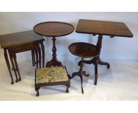 A 19th Century Mahogany Tripod Table, the circular dished top above a turned tapering column and quadripartite base together 