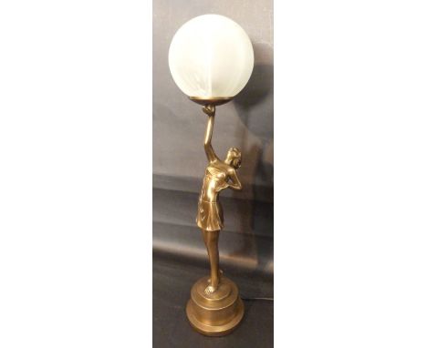 An Art Deco Style Figural Table Lamp in the form of a girl with spherical opaque glass shade