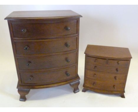 A Miniature Hardwood Bow Fronted Collectors' Chest of four drawer with knob handles raised upon ogee bracket feet together wi