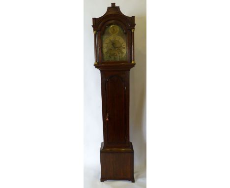 A George III Oak Long Case Clock, the arched hood with tuned pilasters above an arched door, the base with ogee bracket feet,