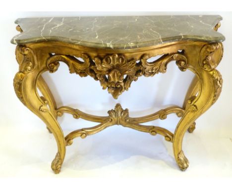 A French Gilded and Variegate Marble Serpentine Console Table, the variegated marble top above a pierced scroll frieze raised