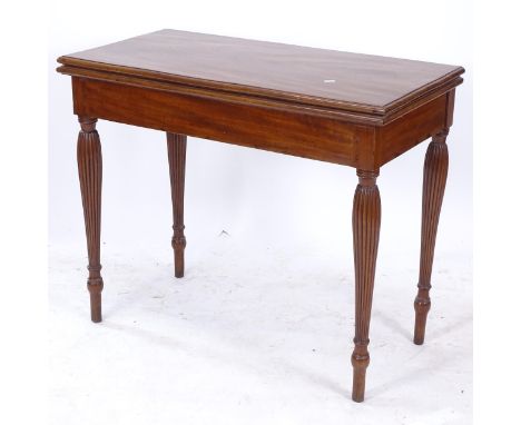 An Antique mahogany rectangular fold over card table, on reeded legs, W92cm, H75cm, D45cm 