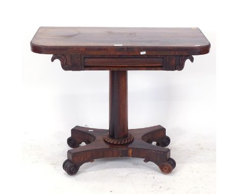 A Regency rosewood fold over card table, on turned centre column and platform base, W91cm, H73cm, D45cm 