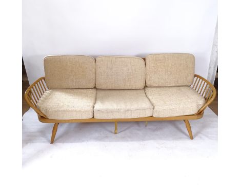 A mid-century Ercol elm and beech daybed/couch, L205cm (webbing in need of attention) 