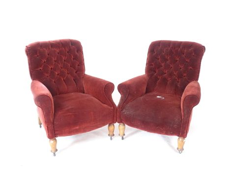 A pair of red button-back upholstered armchairs 
