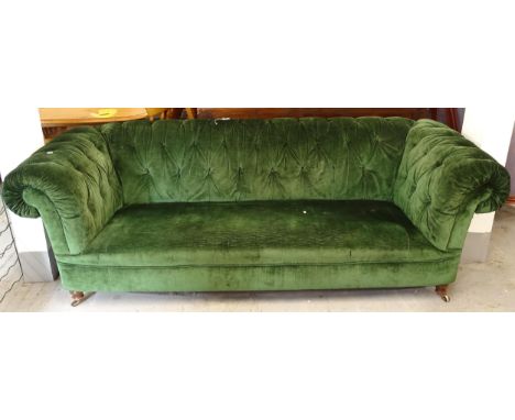 A button-back green upholstered rollover arm Chesterfield settee, L224cm, H75cm, seat height 37cm and depth 56cm 