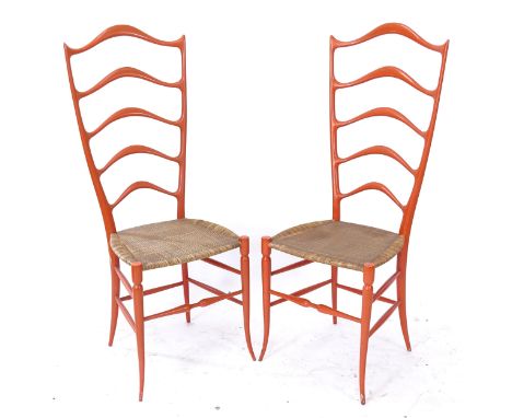 Chiavari, Italy, a pair of exaggerated high ladder-back chairs in sculptured wood, in the manner of Gio Ponti 
