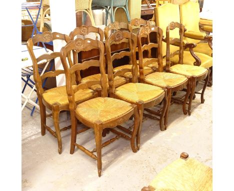 A set of 8 French oak ladder-back dining chairs 
