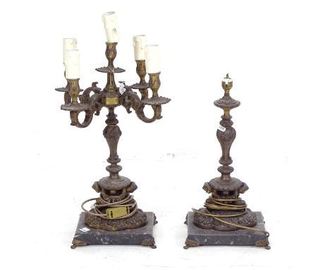 A brass 4-branch table candelabra on a black and white speckled marble base, with cast-brass feet, H63cm, and a matching tabl