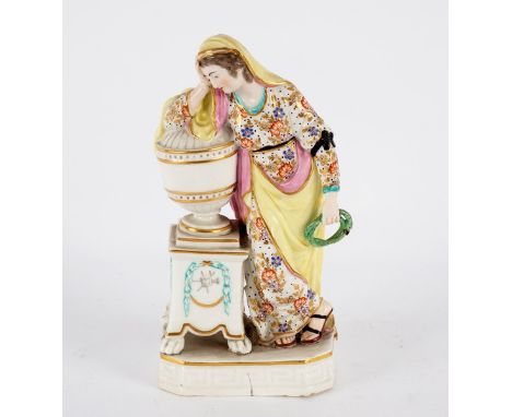 A Derby porcelain figure circa 1780, of Andromache weeping over the ashes of Hector, she leaning on an urn, in one hand a sna