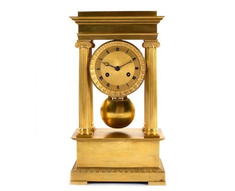 An Empire ormolu portico clock with four Ionic column supports, the movement stamped Pons with a pin wheel escapement and gri