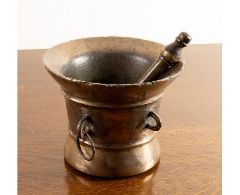 A large English bronze mortar and pestle, 17th Century, 27cm diameter, 21cm high CONDITION REPORT: Creases to metal at edges 