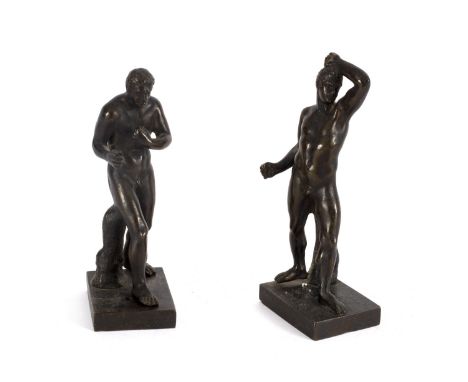 A pair of bronze figures of wrestlers, 19th Century, after the Antique, 12cm high