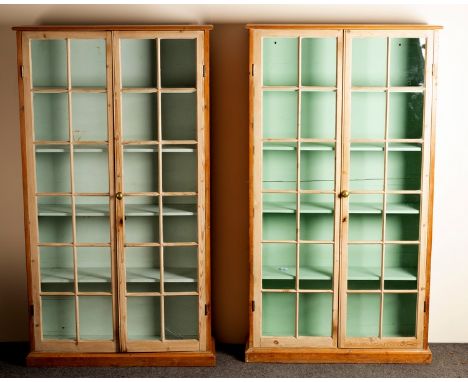 A pair of pine display cases, each enclosed by a pair of glazed doors, 88cm wide CONDITION REPORT: Cabinets date from first h