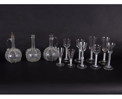 Three engraved Dutch glass decanters, two opaque twist ale glasses, three double series opaque twist wine glasses, a mixed tw