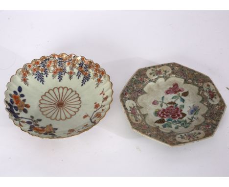 A Japanese Imari scallop edged plate, 22cm diameter, a Chinese famille rose octagonal plate, 21cm wide and a Chinese bowl, 24