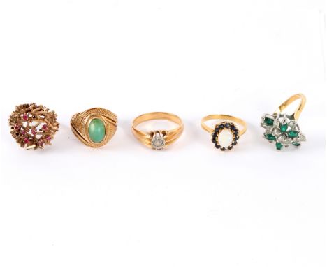 Five dress rings including a ruby set example in the manner of Andrew Grima, a 14K gold ring set with a turquoise cabochon an