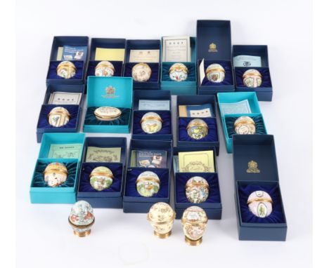 A run of Halcyon Days Easter Eggs from 1975-1991, two other Halcyon Days enamel boxes and stands for the same, many boxed CON