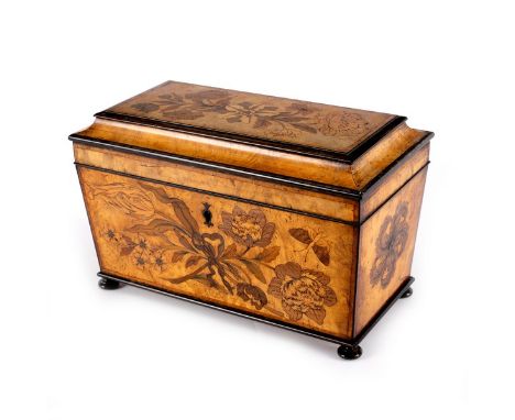 A late Georgian marquetry inlaid tea caddy, the cover and sides with floral inlays, the canisters each with mask inlay, 31.5c
