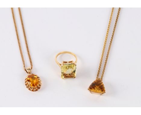 A citrine dress ring in an 18ct yellow gold setting, an oval citrine pendant on a 9ct gold chain and a triangular pendant on 