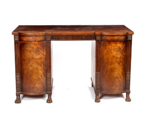 A Regency mahogany sideboard with reeded frieze and bowfront pedestals on carved paw feet, stamped Wilkinson, Ludgate Hill, 1