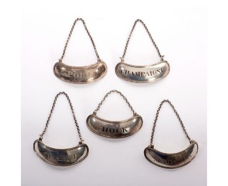 A set of five Irish silver decanter wine labels, James Le Bas, Dublin 1811, of curved form for Claret, Hock, Champagne, Madei