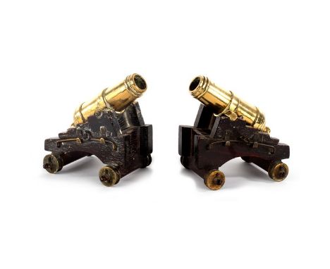 A pair of Militaire bronze cannons, circa 1820, on wooden wheeled carriages, 9cm x 9cm/see illustration
