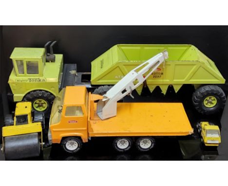 Mighty Tonka lime green Bottom Dump toy. Type number 54690, damage to cab window, 77cm long x 20cm wide x 25cm high, Orange F