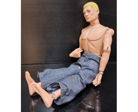 An early Action Man, soft head, flesh coloured rivets, hard hands, c1964 (playworn but intact) 