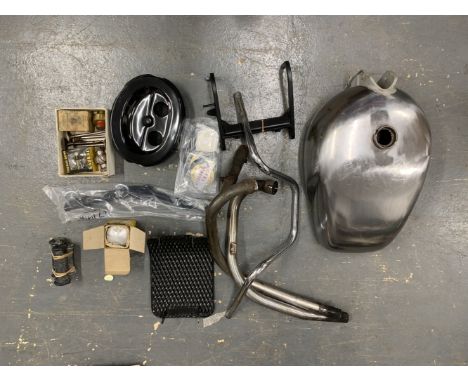 A selection of reproduction Royal Enfield componentsincluding petrol tank; main stand, side stand, airbox, piston, sump guard