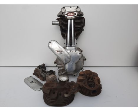 A 1946 Norton ES2 enginenumbered A36038 together with two cylinder heads, condition and completeness unknown, close inspectio