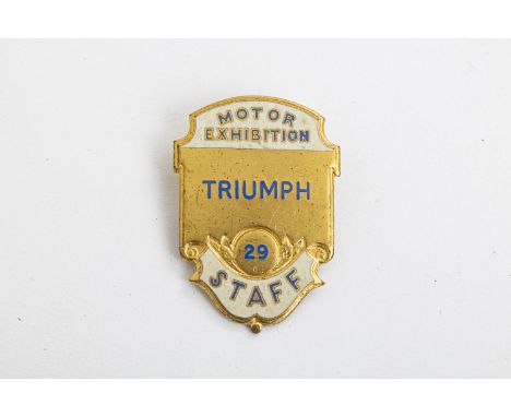 A 1929 Motor exhibition enamel staff badge for Triumphby Caxton of Kew, Surrey. For further information on this lot please vi