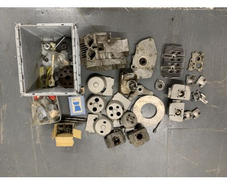 A selection of Tohatsu engine componentsincluding crankcases (unnumbered); cylinder barrels; cylinder heads; carburettor mani
